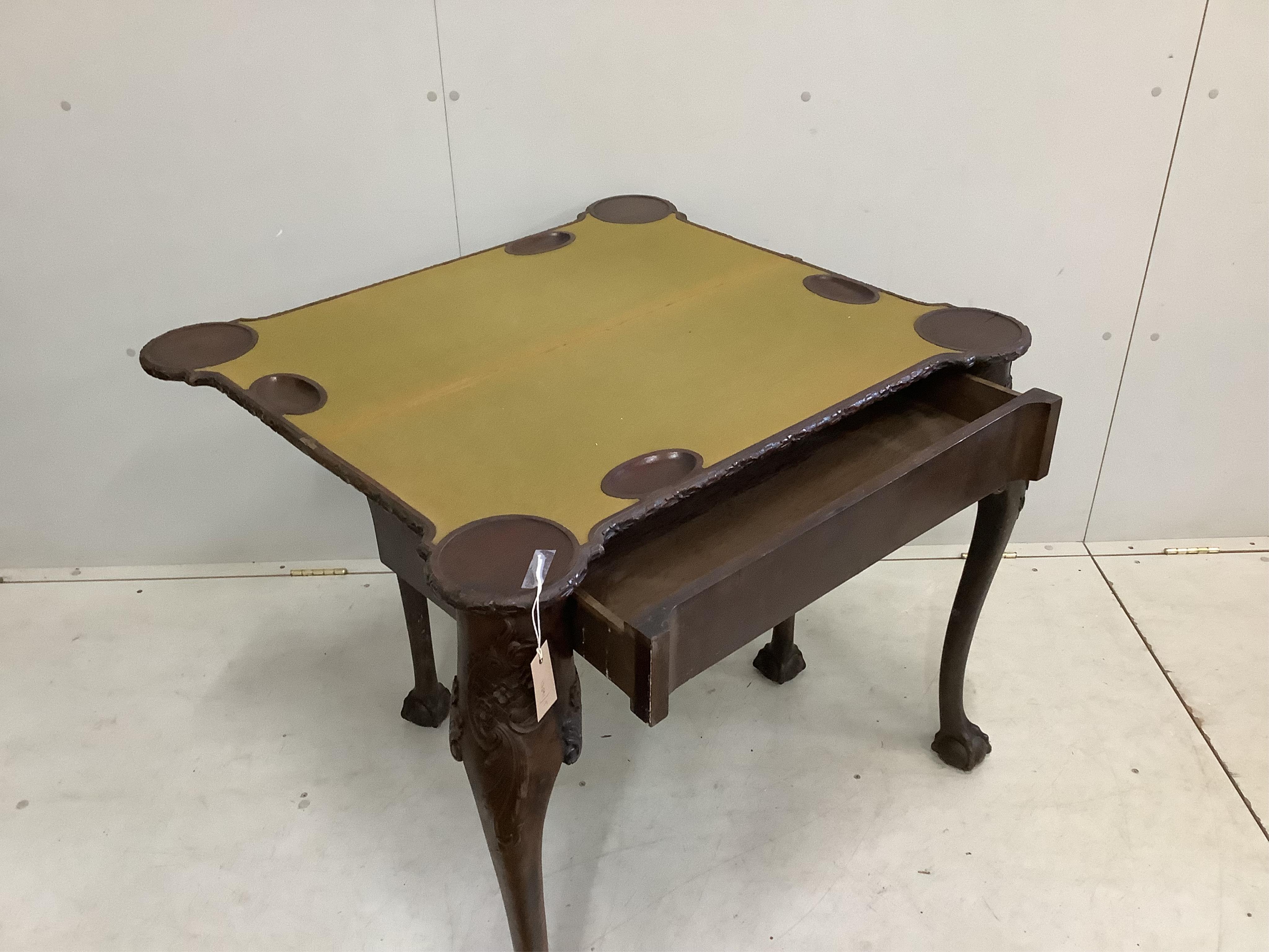 A George II style mahogany folding card table, width 88cm, depth 40cm, height 77cm.